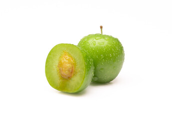 Fresh and green plum on white background