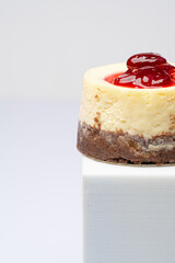 Cheese cake with raspberry on white background