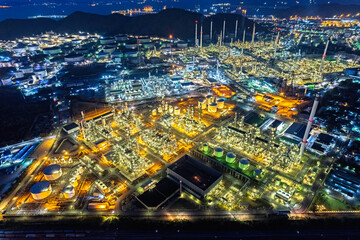 Aerial top view oil refinery and gas petrochemical industry with storage tanks steel pipeline area.