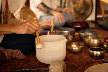 Singing bowls in sound healing therapy with two people.