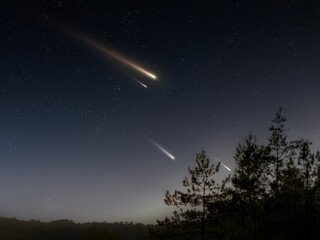 Meteorites in the sky, night landscape. Shooting stars above the treetops. Bright flashes from meteors.