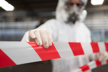 Restricted area, officials employ white and red stripes to block the area where a chemical leak is...