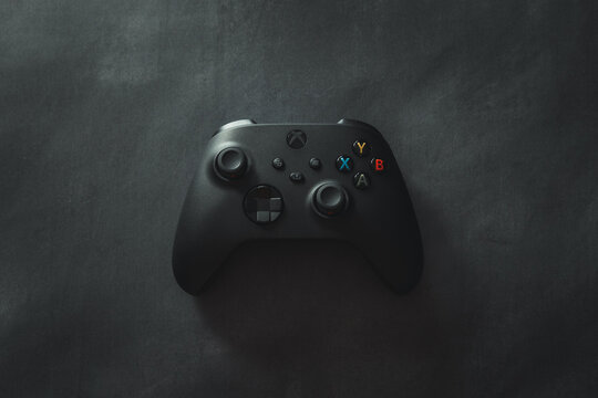 LONDON - MAY 11, 2023: Xbox Series X black gaming controller top view on dark background