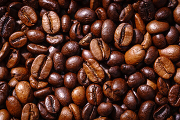Obraz premium Palone ziarna kawy wypełniające tło