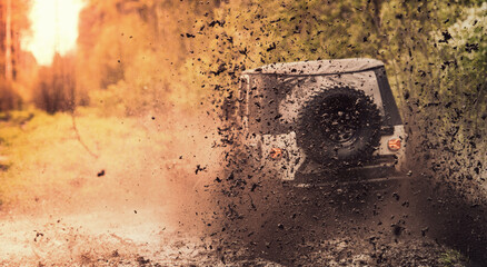 Offroad vehicle driving through the mud.