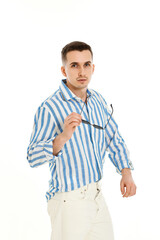 handsome young man in sunglasses and blue striped shirt