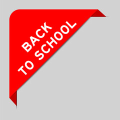 Red color of corner label banner with word back to school on gray background