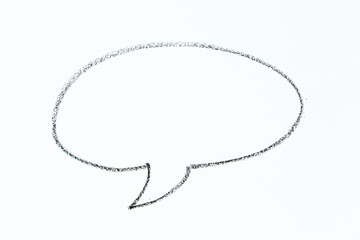 black color oil pastel hand drawing in round speech banner shape on white paper background with copy space