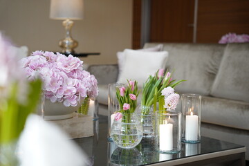 Nice cute decoration for guests in the living room, waiting room, wedding, hospital reception, hotel and spa. Waiting for an area with nice pink tulips, flowers and candles.