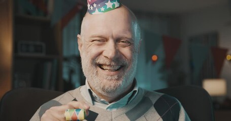 Lonely senior man celebrating alone