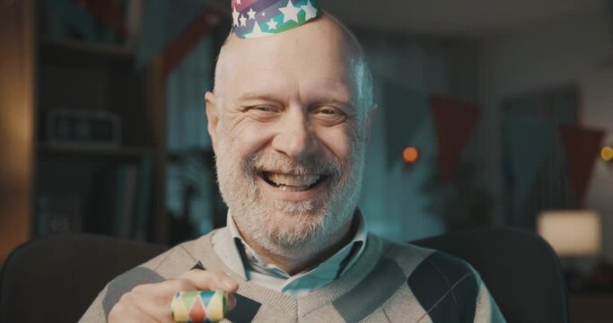 Lonely senior man celebrating alone