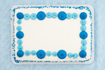 Blank white and blue birthday cake