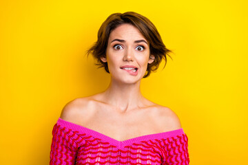 Portrait of impressed frightened pretty woman with short haircut wear pink dress biting lips...