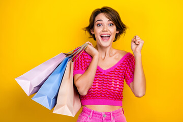 Photo of young crazy surprised bob brown hair shopaholic raised fist up hold bags from new internet...