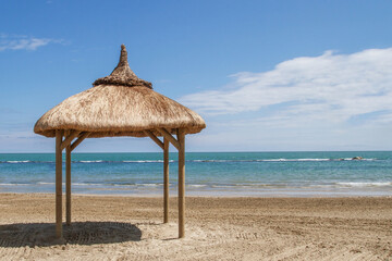 Fototapeta premium Beautiful Asian-style straw bungalow on the beach