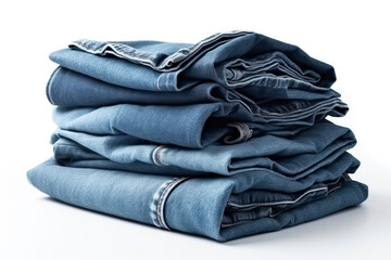 Stack of blue denim clothes on white background, jeans and jacket.