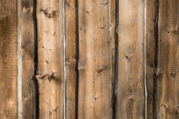 Aged boards of brown color, the surface is slightly worn.