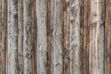 Boards of aged wood, reddish and whitish color worn by the passage of time.