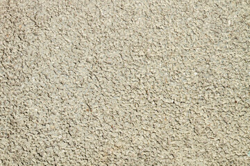 the texture of a plaster or wall with small indentations.