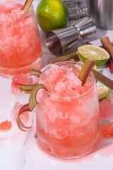 Refreshing summer rhubarb sour fizz cocktail, frozen fizz cocktail, sweet rhubarb slushy with sirup, rum and champagne. Refreshing cold and healthy summer cocktail