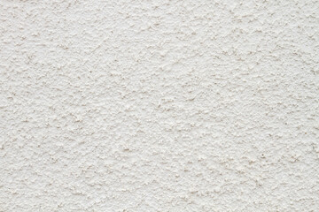 the texture of white plaster or a wall with small indentations.6