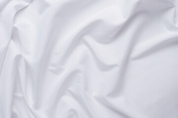 Obraz premium White fabric. luxurious white fabric texture background. Creases of satin, silk and cotton.