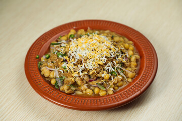 Spicy chotpot masla chaat with chana, chola, chilli served in dish isolated on table top view of indian, bangladeshi and pakistani street food