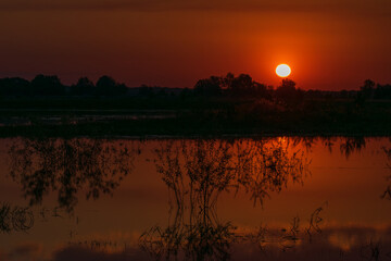 Obraz premium sunrise over the river