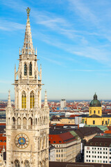 Fototapeta na wymiar View of tower of Neues Rathaus (New Town Hall) and rest of Munich, Bavaria, Germany. Famous Landmark in München, Bayern, Deutschland.