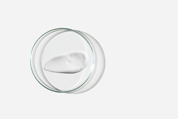 Foam, foam texture. Washing with foam. Foam in a Petri dish on a light background. Dab of cosmetic...