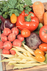 Healthy vegetables in wooden box as snack containing vitamins