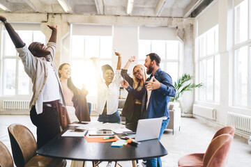 Group of diverse colleagues celebrating victory