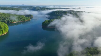 Landscape with lake beneath morning clouds and fog in mountains of Tennessee near Rocky Top at...