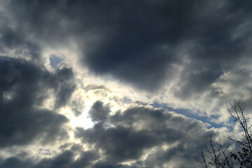 anxious dramatic landscape, echanges in weather, blue sky with white and dark clouds, concept of...