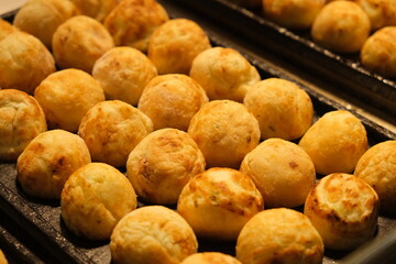 close up many Takoyaki cooked on pan. snack food in Taiwan and Japan