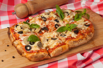italian vegetarian pizza with zucchini mushrooms olives and cheese