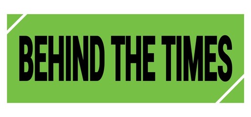 BEHIND THE TIMES text on green-black grungy stamp sign.