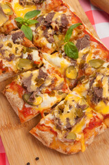 pizza with beef gherkins and jalapeno, mozzarella cheese and cheddar sauce