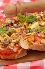 pizza with beef gherkins and jalapeno, mozzarella cheese and cheddar sauce