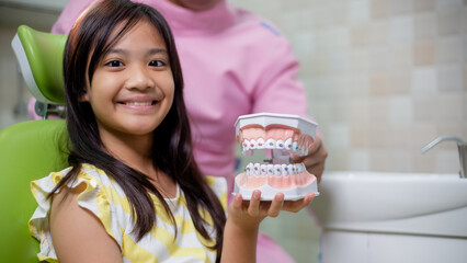 Little Asian girls teeth are healthy in the Dental office. Dental care, Dentist care.