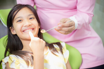 Little Asian girls teeth are healthy in the Dental office. Dental care, Dentist care.