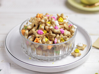 Selective focus of a bowl of sweet colorful ice gem rose cookies or in Malaysia they called it Biskut Ais Jem