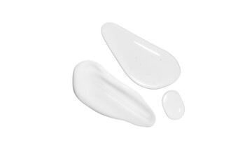 Drops of transparent gel and a dab of white cosmetic cream. On a white background.