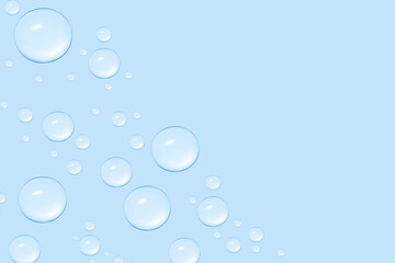 Drops of transparent gel or water in different sizes. On a blue background.