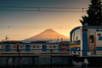 Volcano mount Fuji with sunset sky on railway station at Kawaguchiko station