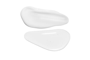 Drops of transparent gel and a dab of white cosmetic cream. On a white background.