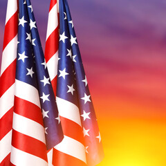 National American flags on the background of the sunset. USA holidays.