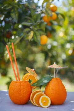 beautiful, juicy, ripe oranges lie on the table, a charge of vitamin and energy. the picture reproduces the theme of weight loss