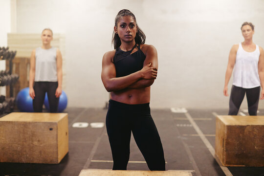 Muscular young woman ready for a box jump class
