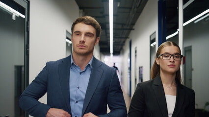 Fototapeta premium Business partners walk office hallway. Successful financial managers go client